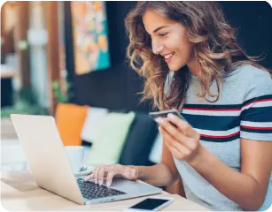 woman making purchase on laptop via authorize.net gateway